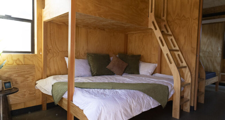A bed made in a Family Cabin bunk.